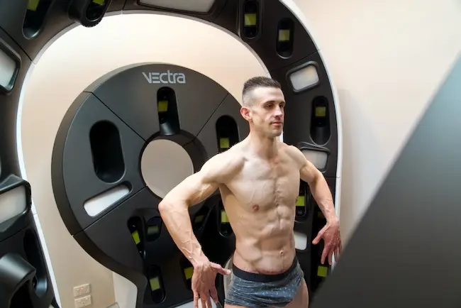 Patient standing in front of the Skin Check 360 machine at Yarra Trail Medical in Melbourne by Exposja Photography